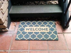 Welcome Mat at the Bottom of Staircase leading to Suite 303