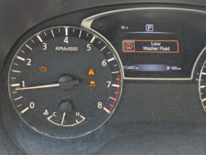 Photo of check engine light and other car warning lights on. This serves as a metphor for the urge we expeince in BFRB (Body focused Repetitive Behaviors such as trichotillomania and excoriation skin picking disorders)